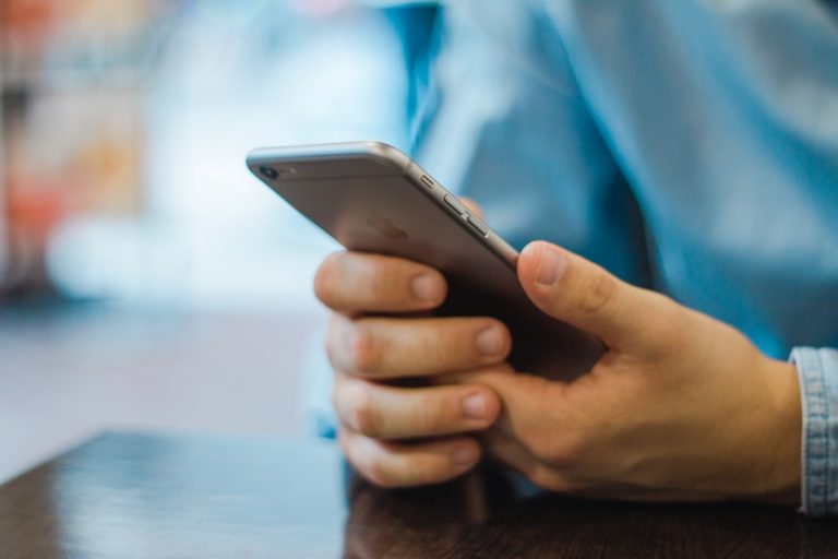 a close-up of a hand holding a phone