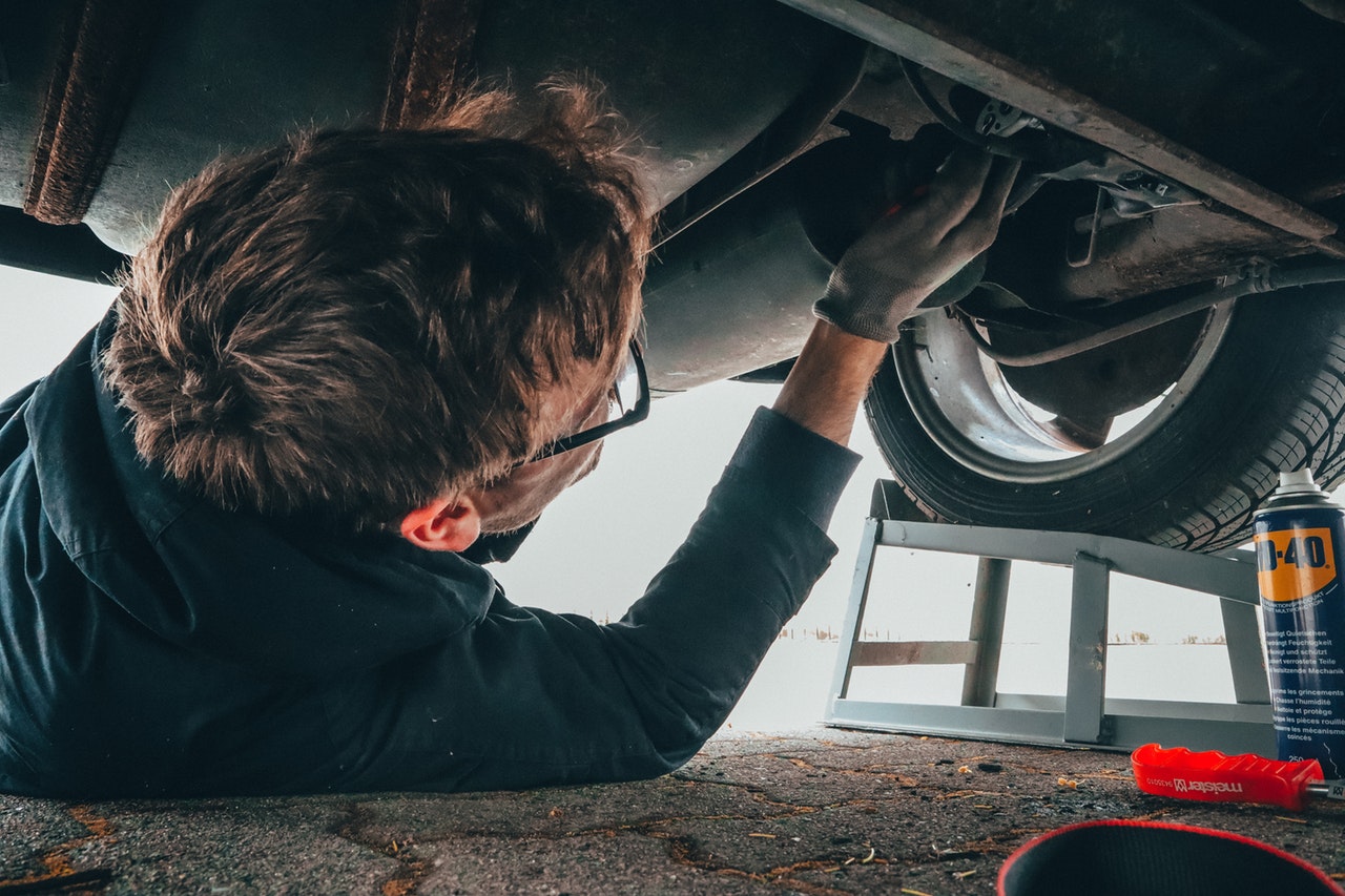 a person fixing a car tire