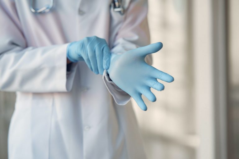 a doctor holding a glove