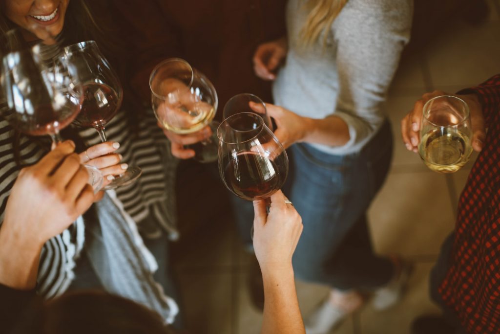 a group of people holding wine glasses