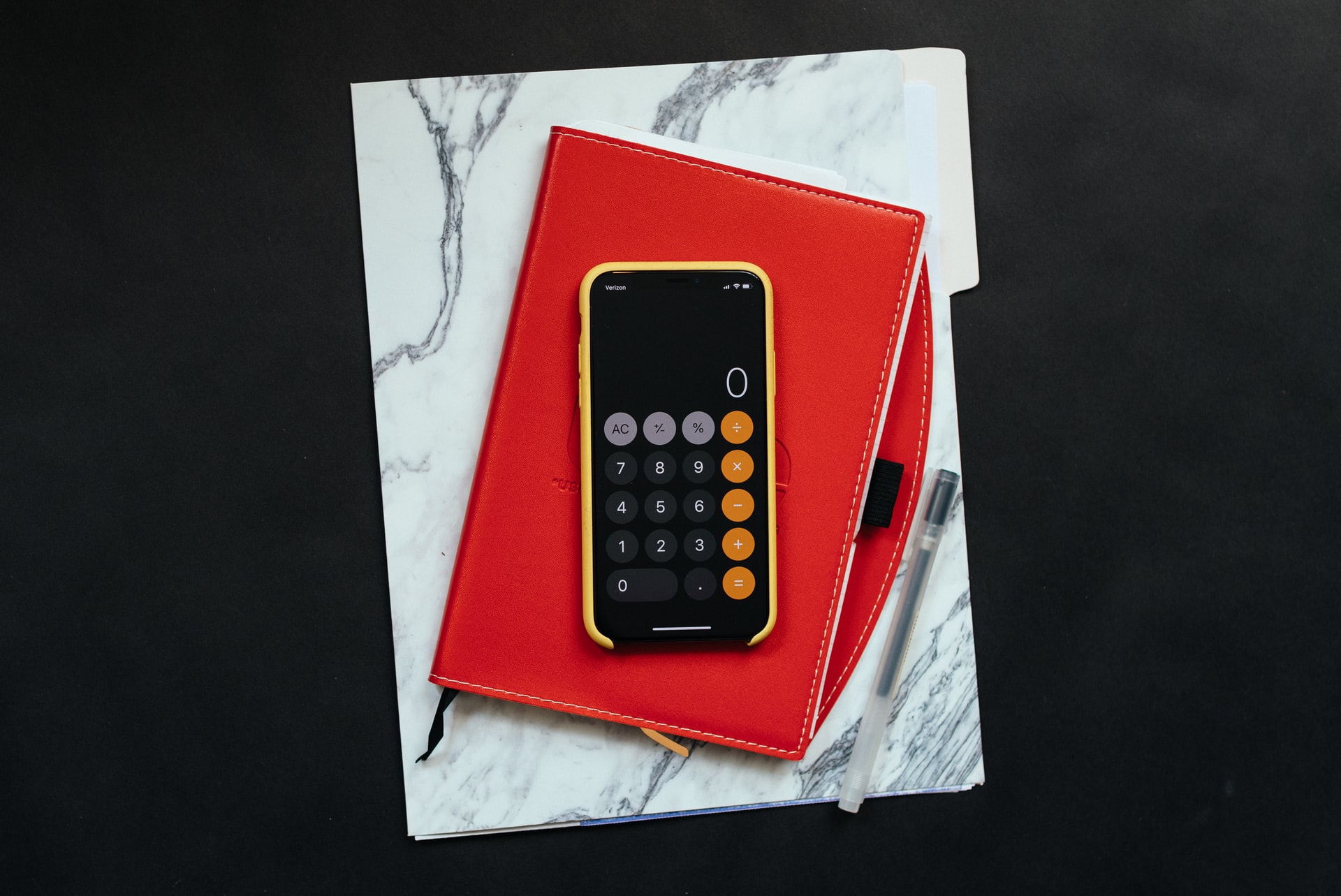 a calculator in a red case