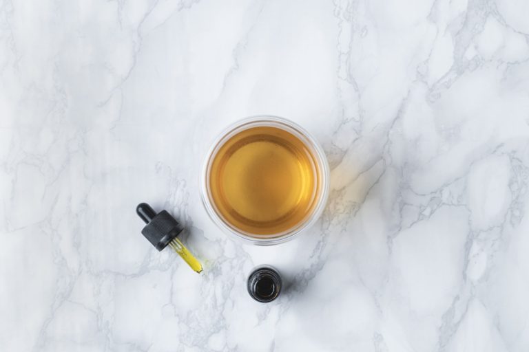 a cup of tea on a white surface